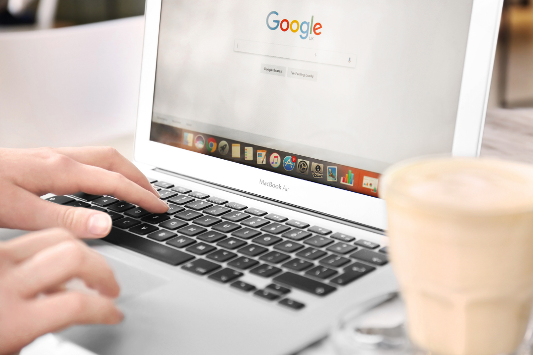Business owner updating their Google Business Profile on a laptop.